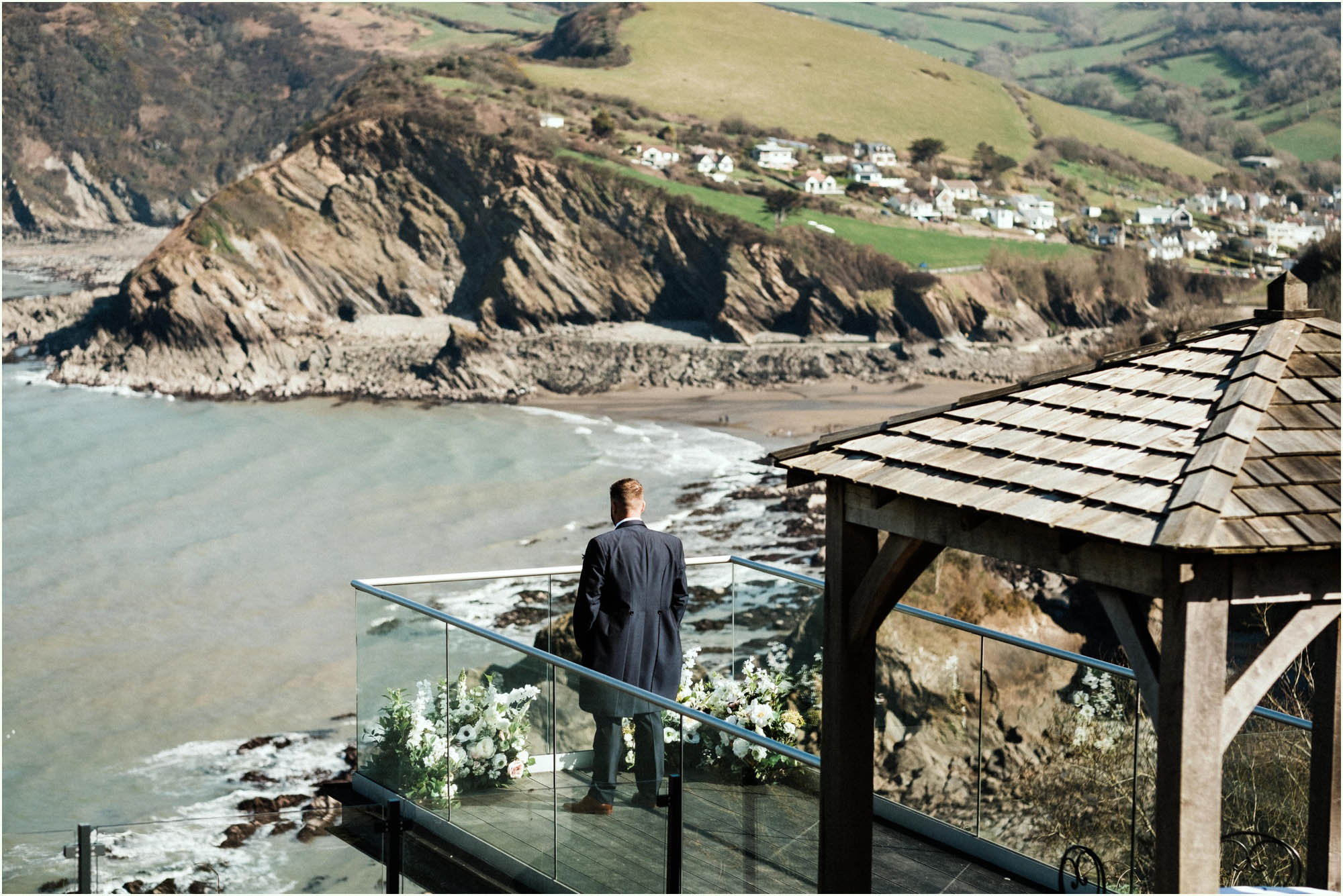 Adam and Abbie's Sandy Cove wedding in Devon with an outdoor ceremony and elegant summer styling in ivory and blush