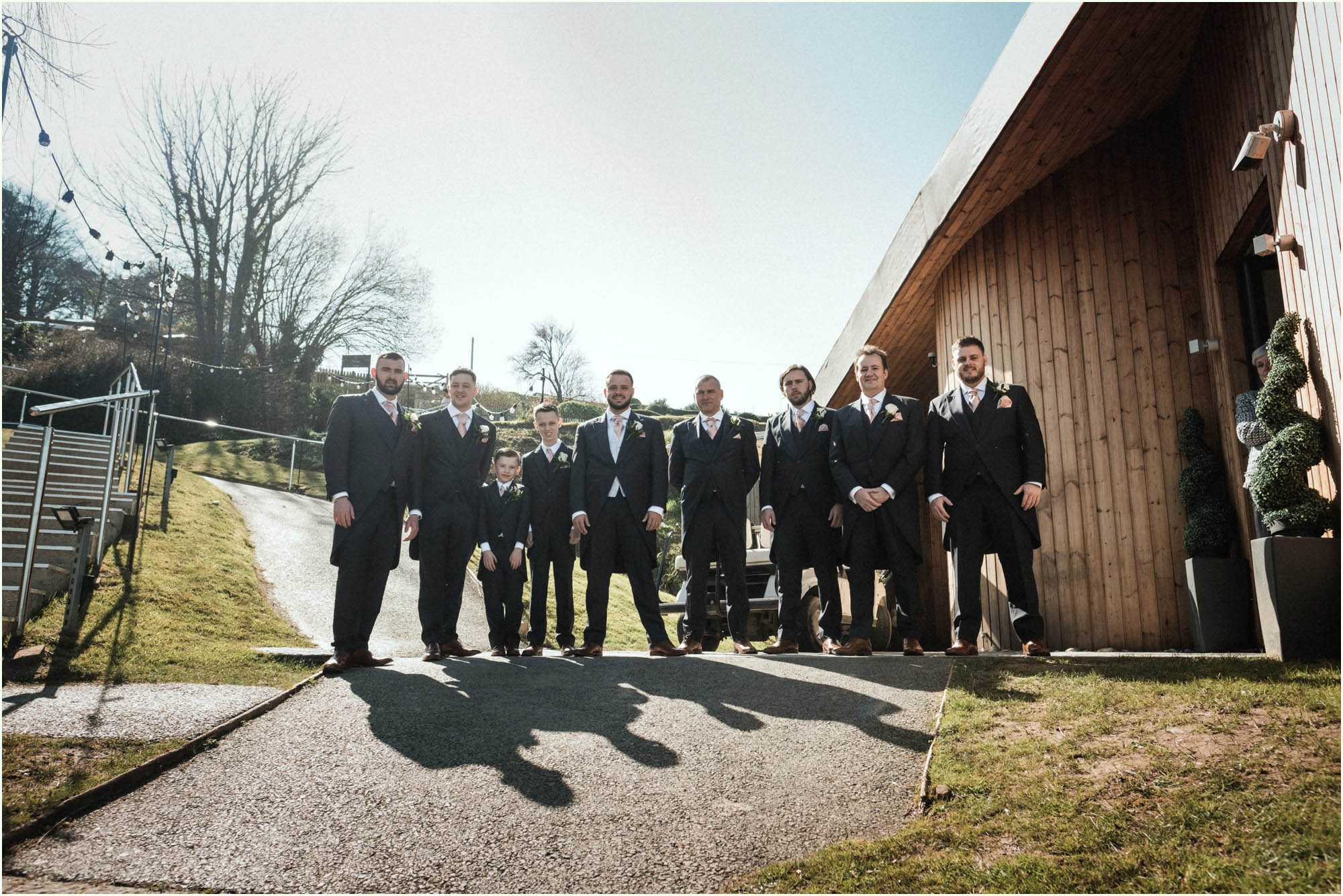 Adam and Abbie's Sandy Cove wedding in Devon with an outdoor ceremony and elegant summer styling in ivory and blush