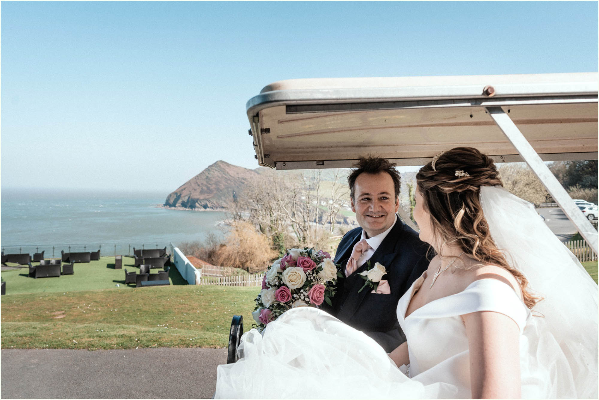 Adam and Abbie's Sandy Cove wedding in Devon with an outdoor ceremony and elegant summer styling in ivory and blush