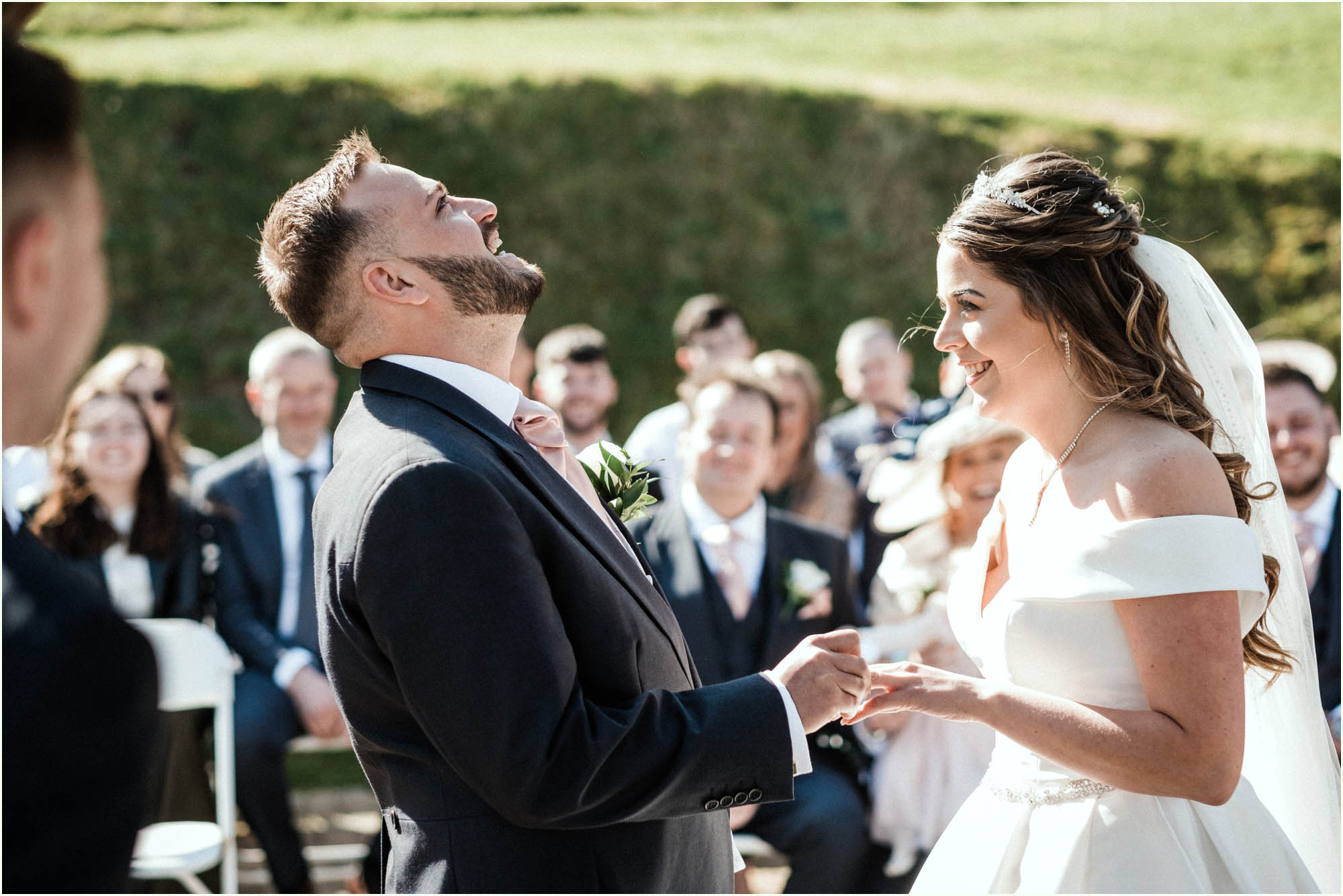 Adam and Abbie's Sandy Cove wedding in Devon with an outdoor ceremony and elegant summer styling in ivory and blush