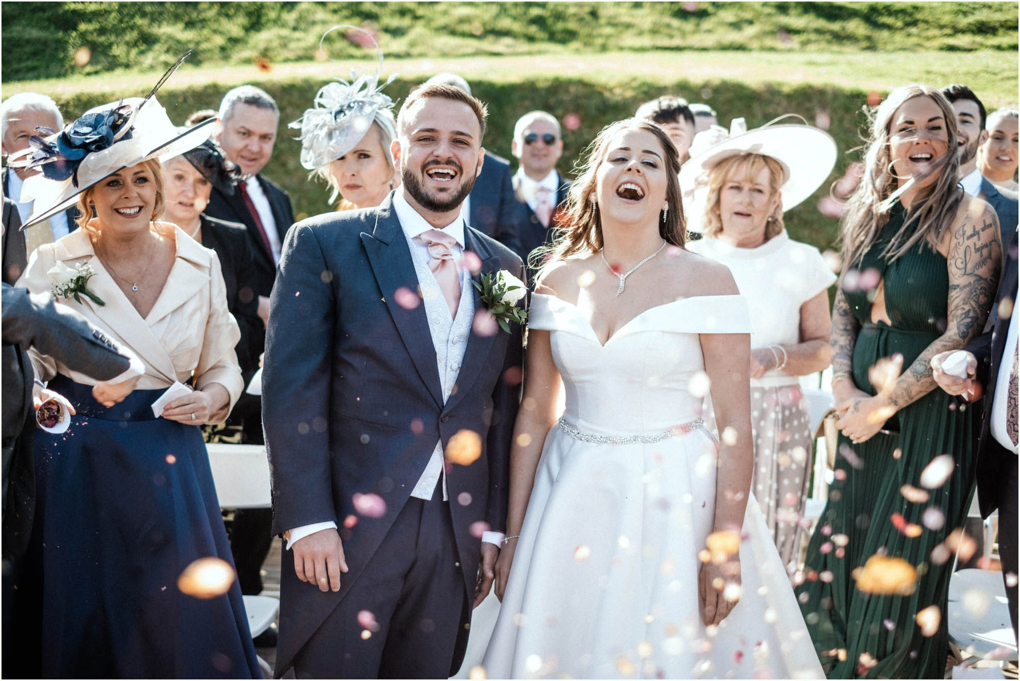 Adam and Abbie's Sandy Cove wedding in Devon with an outdoor ceremony and elegant summer styling in ivory and blush