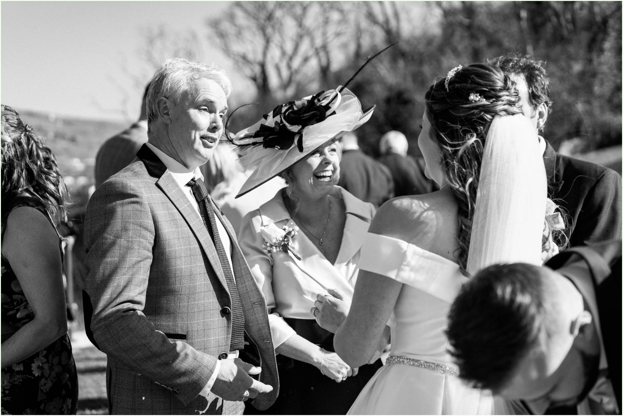 Adam and Abbie's Sandy Cove wedding in Devon with an outdoor ceremony and elegant summer styling in ivory and blush