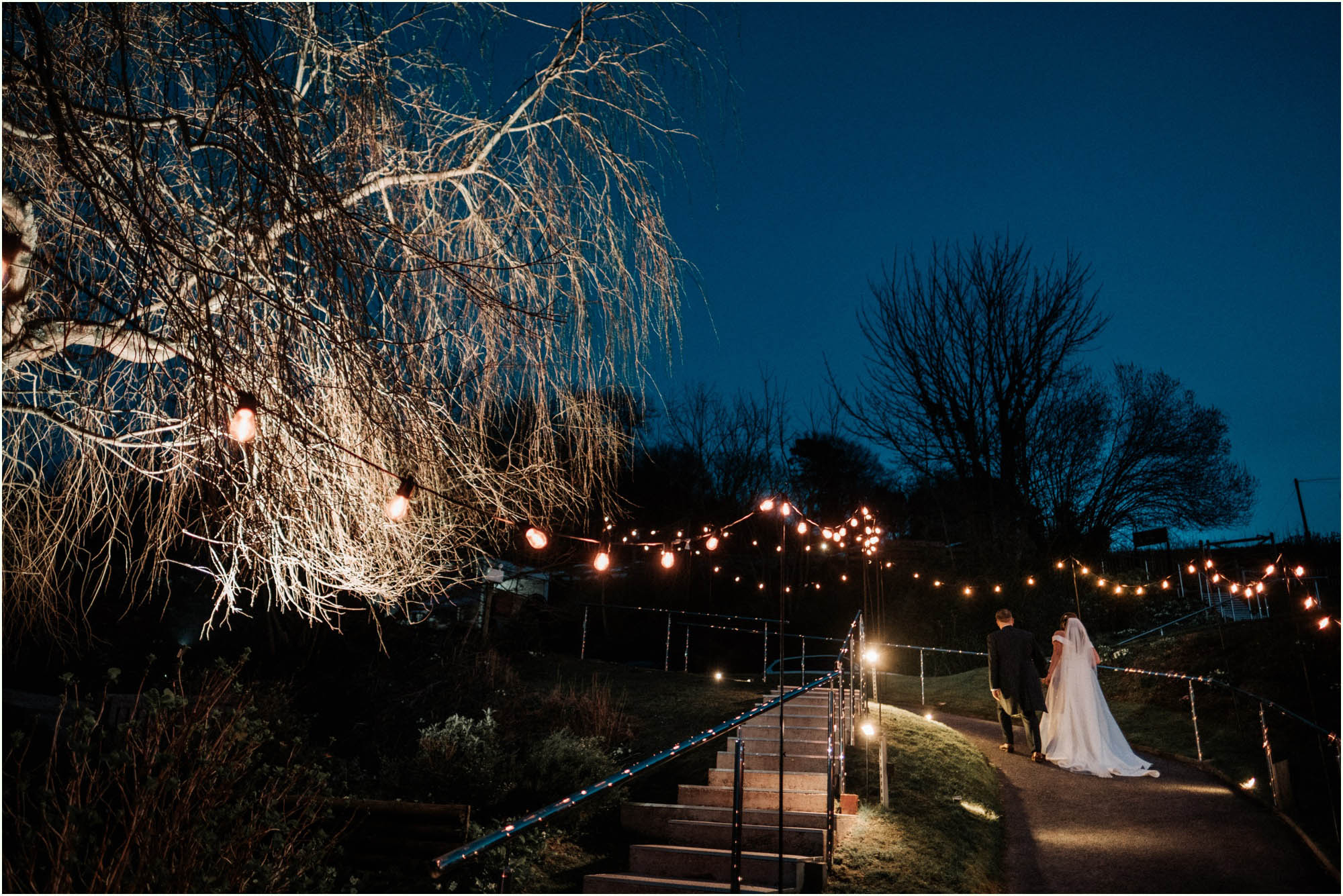 Adam and Abbie's Sandy Cove wedding in Devon with an outdoor ceremony and elegant summer styling in ivory and blush