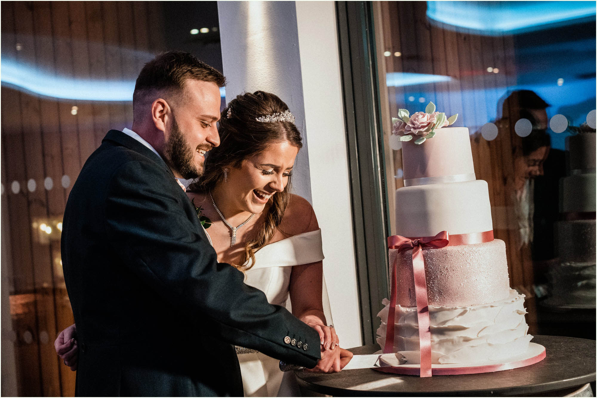 Adam and Abbie's Sandy Cove wedding in Devon with an outdoor ceremony and elegant summer styling in ivory and blush